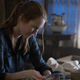 Nina searches for clues.